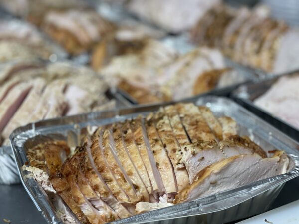 Roasted turkey breast sliced thin ready to reheat